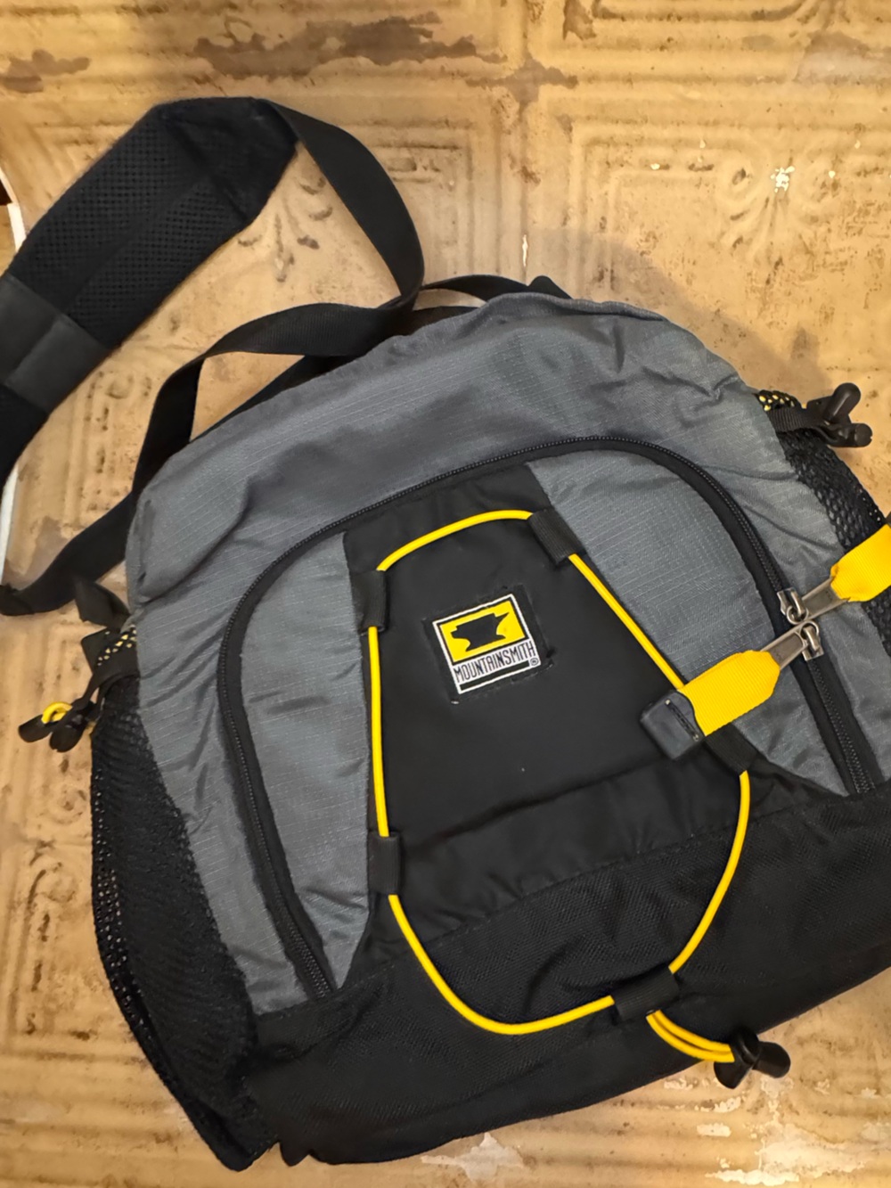 Mountainsmith Carin Lumbar Gray and Black Sling Backpack with Yellow Accents